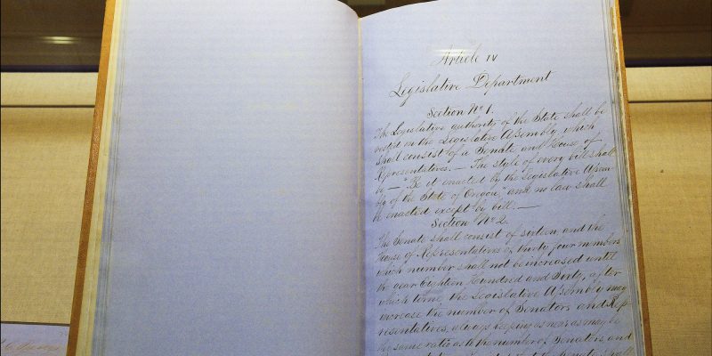 Hand written pages of the Oregon Constitution.