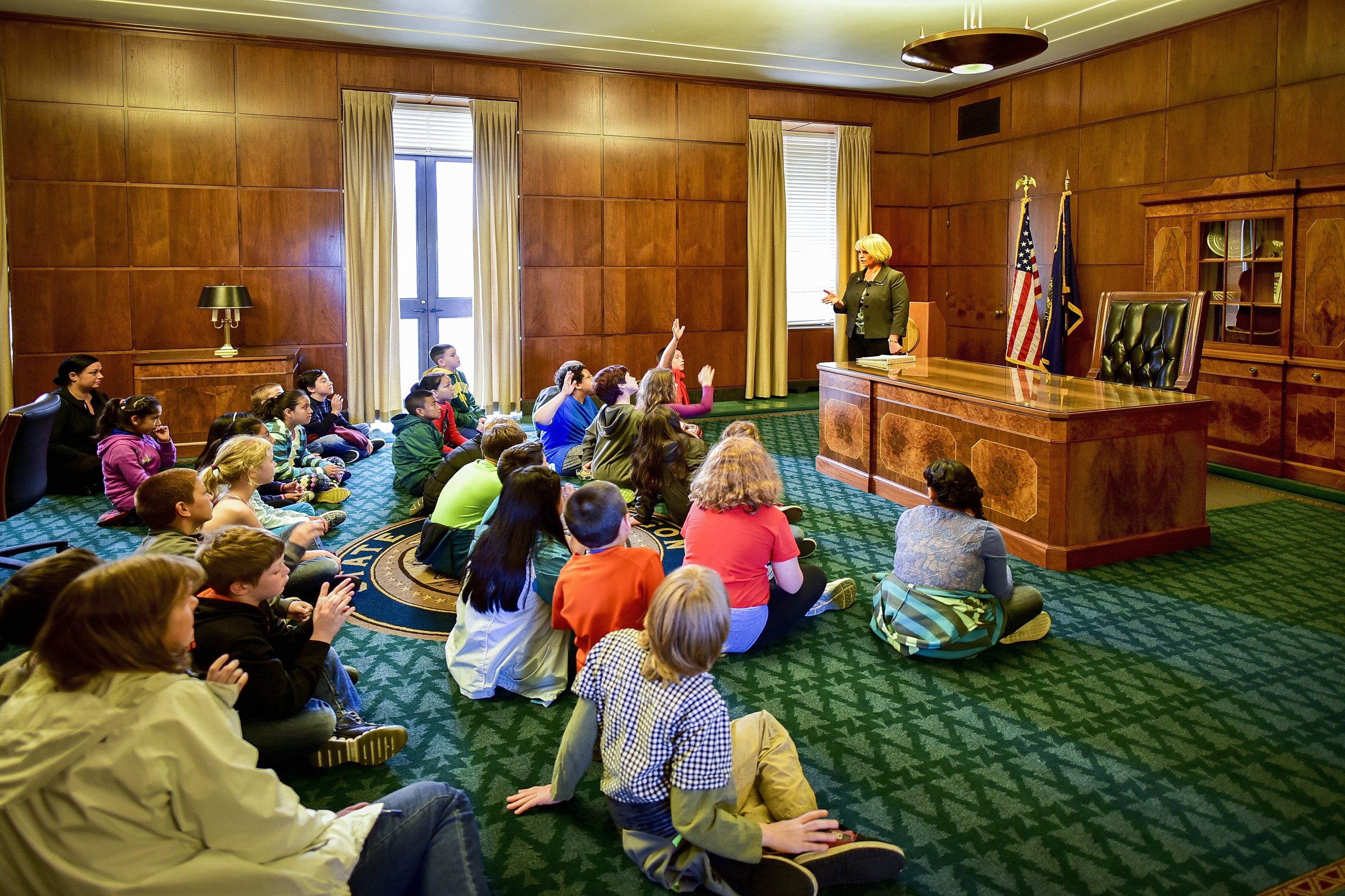 School Children Sit in the Governor's Ceremonial Office During a School Tour
