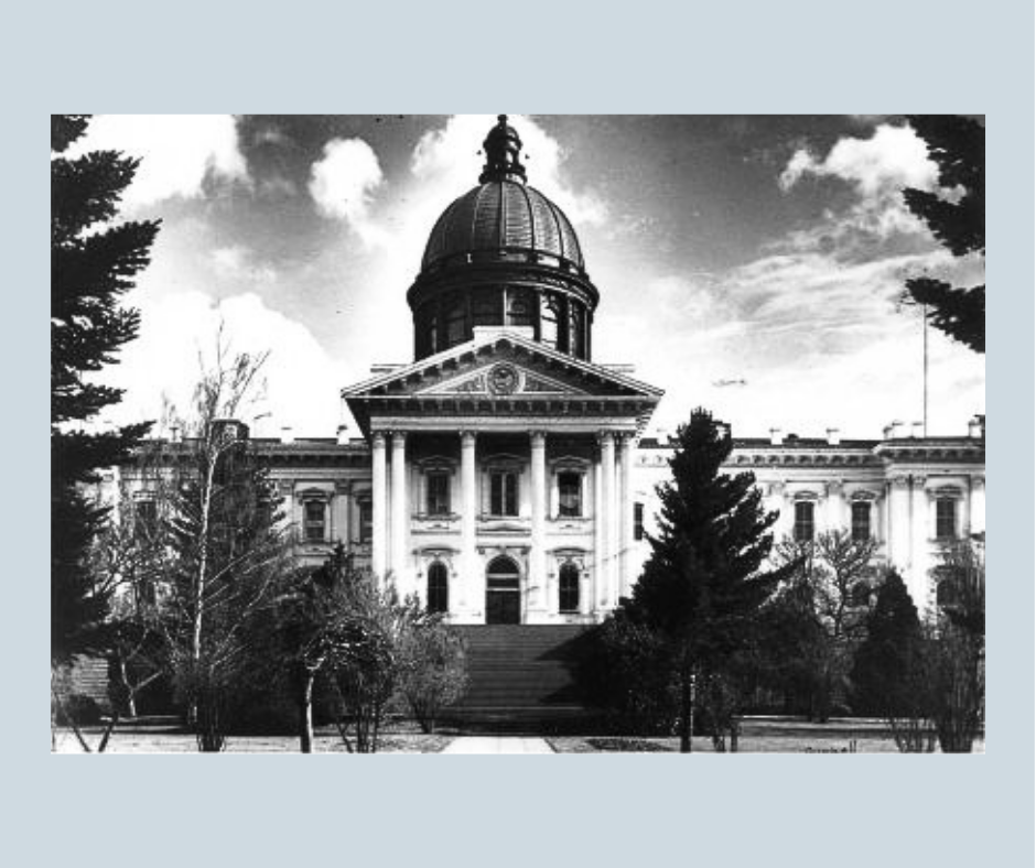 A black and white photo of Oregon's second Capitol building, showing the front steps and dome
