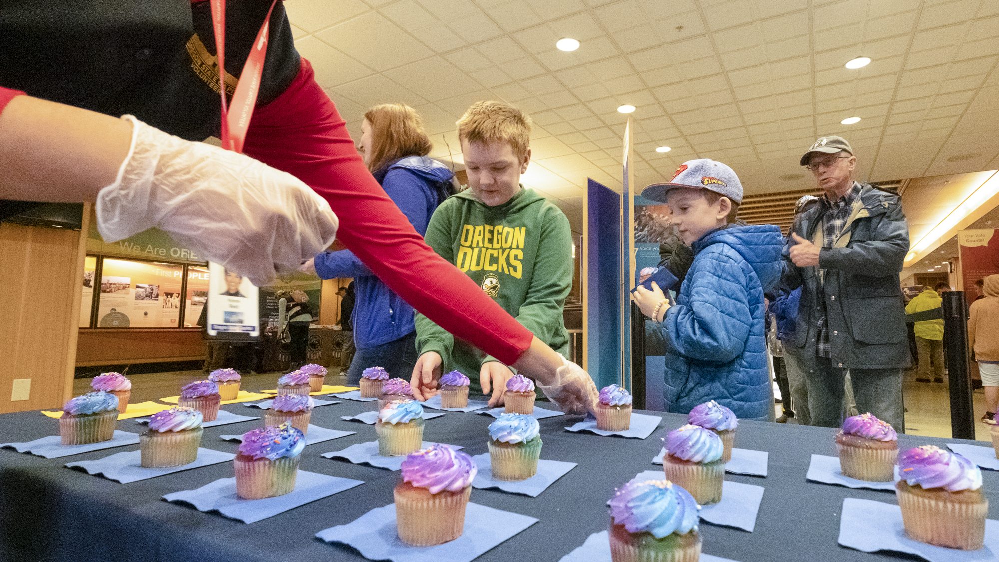 Families receiving free cupcakes during the Birthday Celebration.